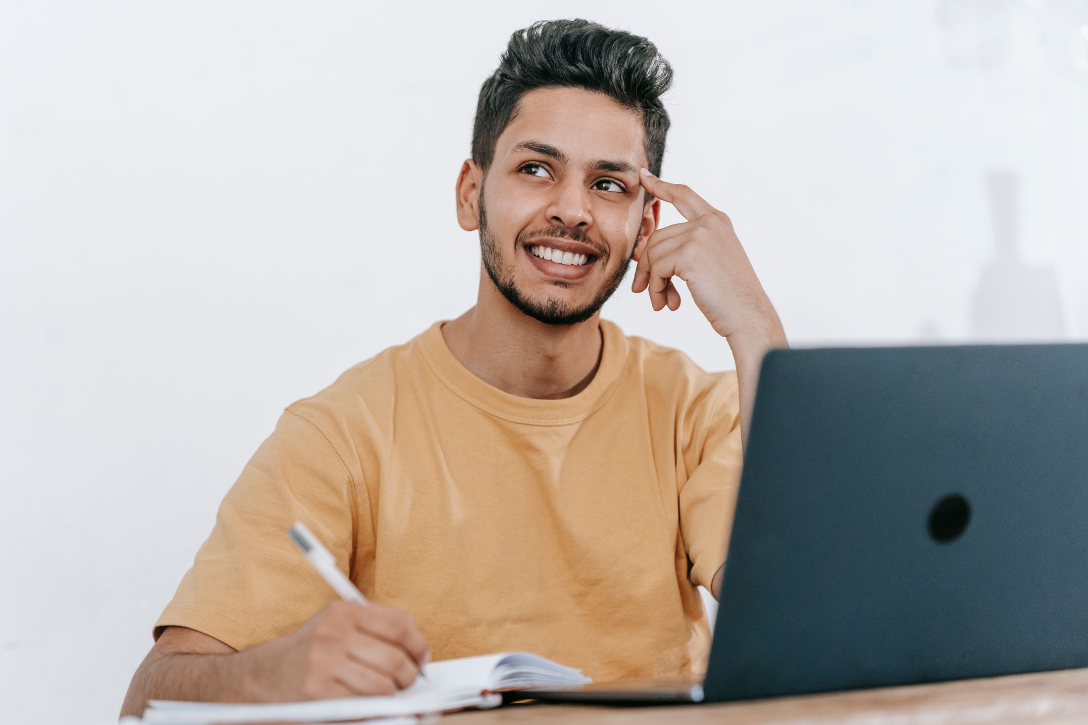 Illustrative stock: a man planning at a laptop